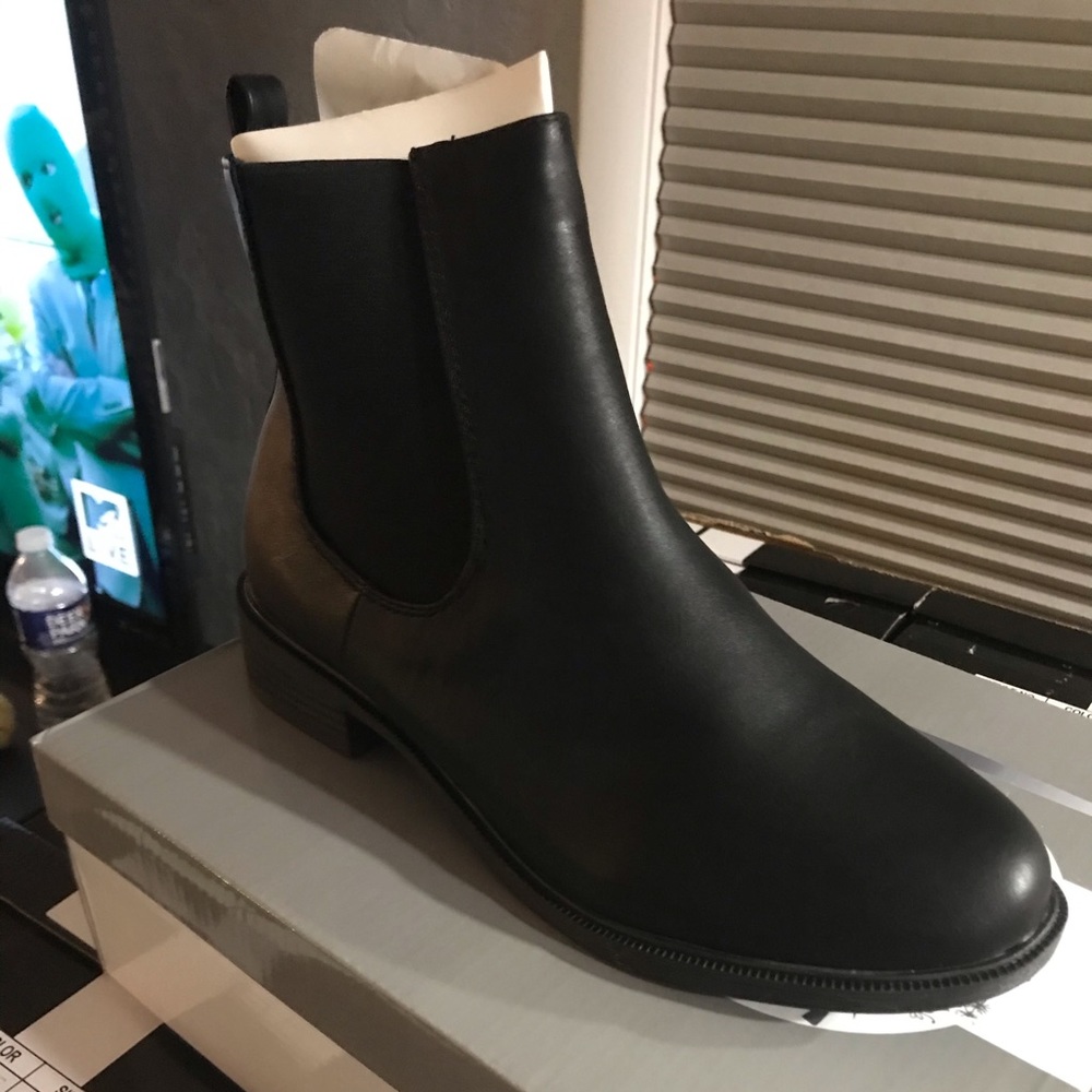 Brand new faux black leather boots.